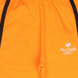 Orange kids shorts with elastic waistband, black side stripes, and 'Chic & trendy' print
