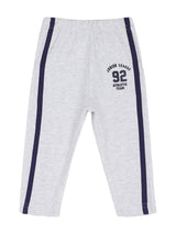 Light grey kids athletic track pants with navy side stripes and 'Junior League 92' print
