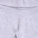 Close-up of light grey kids innerwear fabric with soft stitching and elastic waistband.