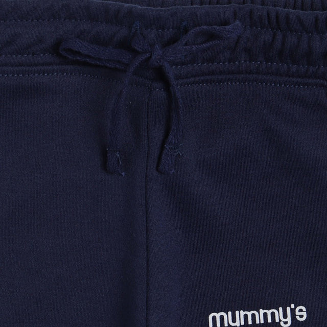 Navy blue kids elastic waist pants with drawstring and partial 'mummy's' text visible