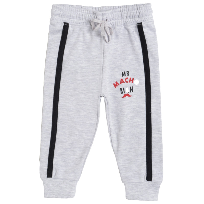 Light grey boys' joggers with black side stripes and 'MR MACHO MAN' graphic print