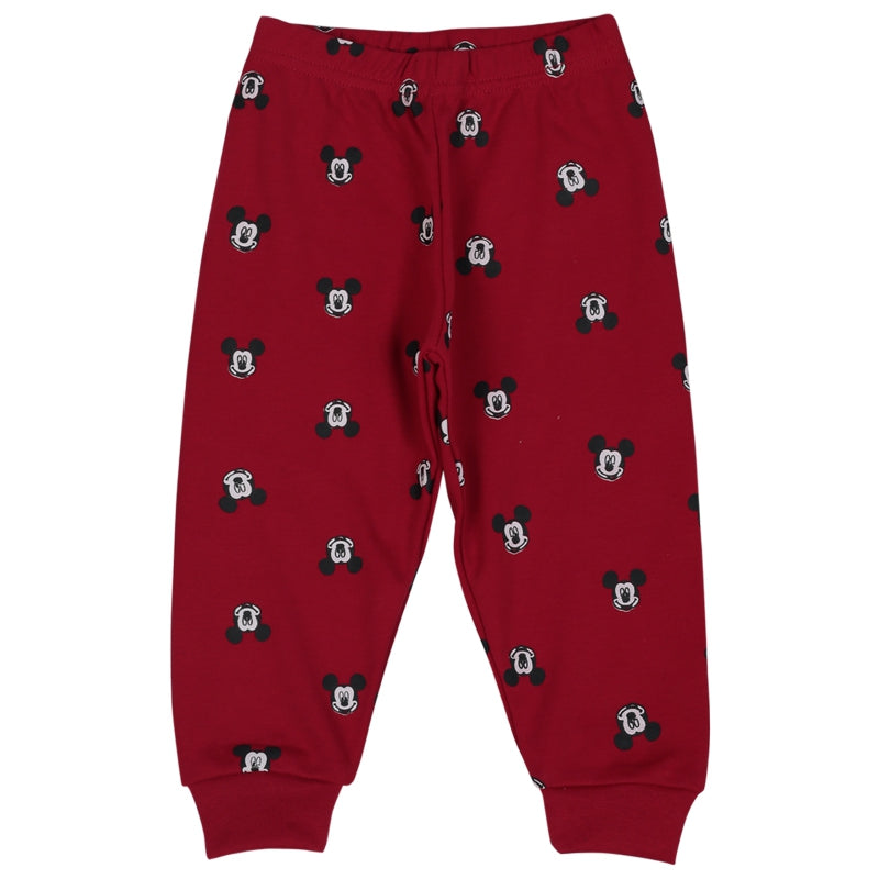 Red kids pajama pants with black cartoon head prints, elastic waist and cuffed ankles.