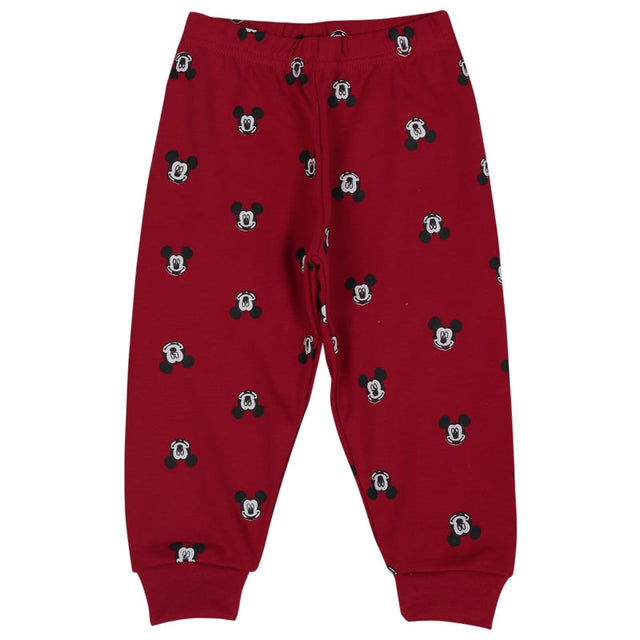 Red kids pajama pants with black cartoon head prints, elastic waist and cuffed ankles.