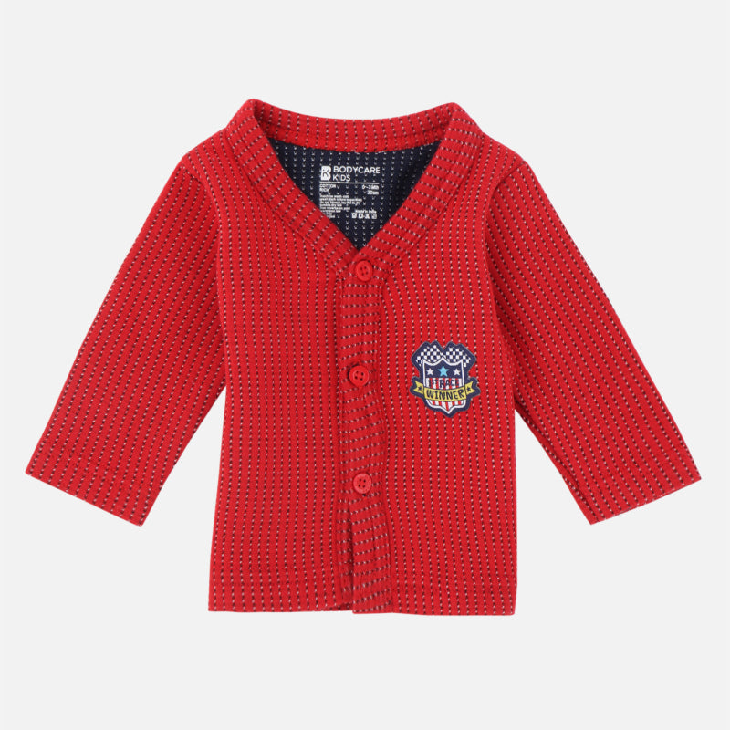 Red kids' winter thermal button-up top with long sleeves and embroidered winner badge