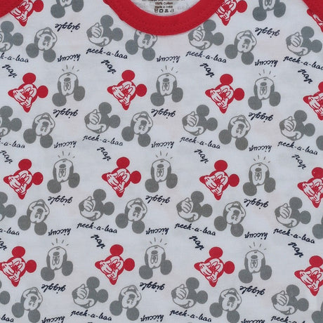 Kids cotton innerwear with red neckline, cartoon face print and playful text on white fabric