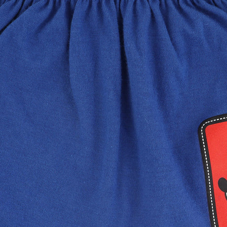 Close-up of blue kids innerwear fabric with elastic waistband and red cartoon patch detail