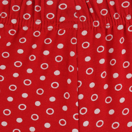 Red kids innerwear with white polka dot pattern and elastic waistband closeup