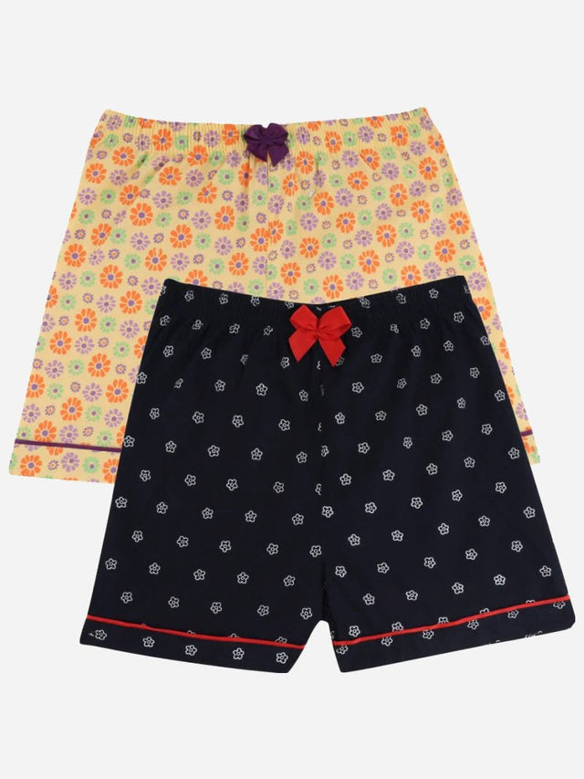 Kids innerwear shorts multipack, one navy with white floral print, one yellow with colorful flowers.
