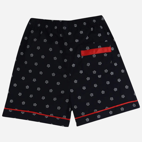 Kids' black floral shorts with elastic waistband, red trim, and back pocket