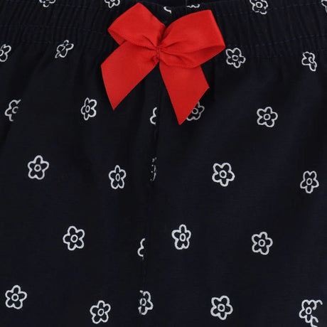 Navy blue kids innerwear with white floral print and red bow accent