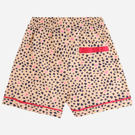 Kids' beige printed shorts with heart and dot pattern, elastic waist, red trim, and pocket