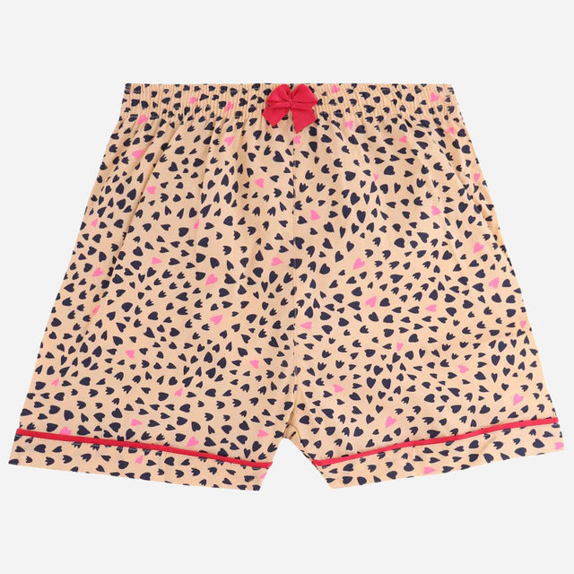 Kids beige shorts with black and pink heart print, red bow, and elastic waistband