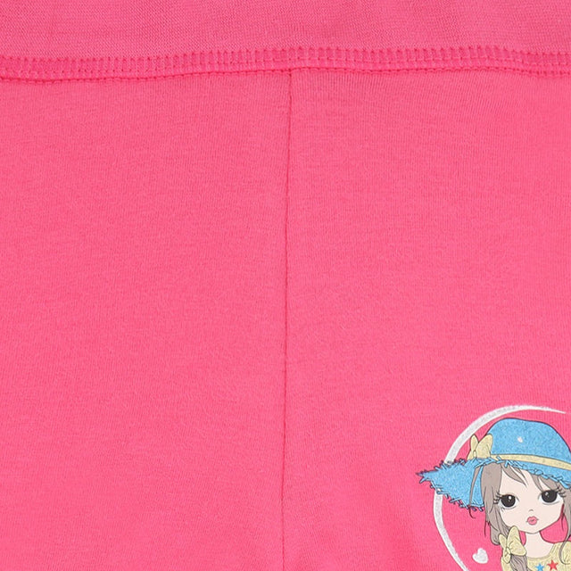 Closeup of pink kids' innerwear with cartoon girl print and visible stitching.
