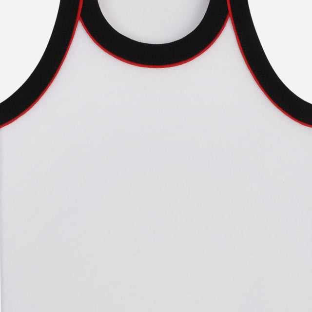 White kids sleeveless innerwear with black and red trim on neckline and armhole