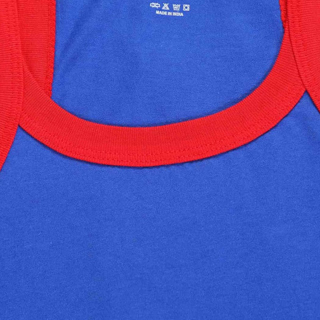 Closeup of blue kids innerwear shirt with red neckline and soft cotton fabric