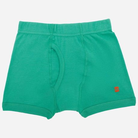 Green boys' cotton trunks underwear with elastic waistband and front fly, laid flat