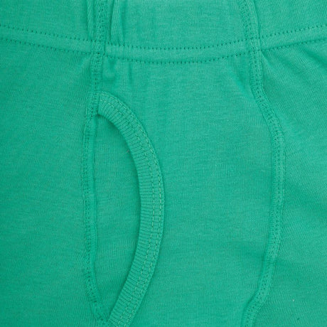 Close-up of green cotton kids innerwear with visible seams and soft fabric texture