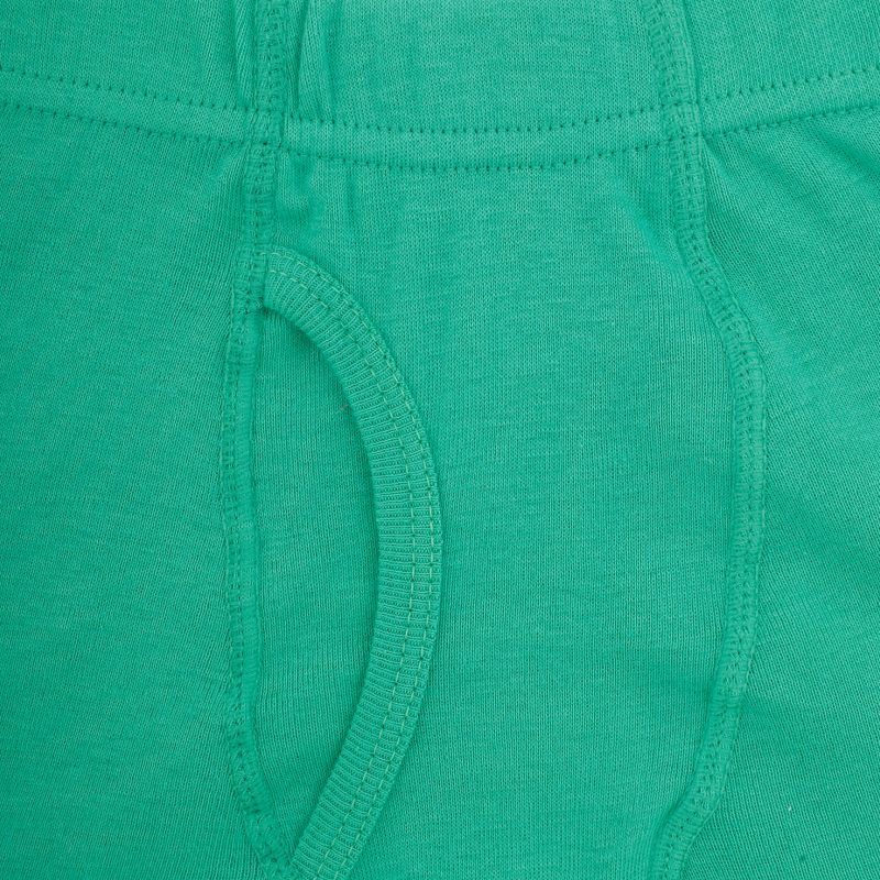 Close-up of green cotton kids innerwear with visible seams and soft fabric texture