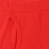 Close-up of red kids innerwear with soft cotton fabric and visible stitching details
