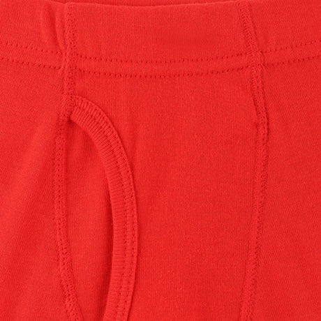 Close-up of red kids innerwear with soft cotton fabric and visible stitching details