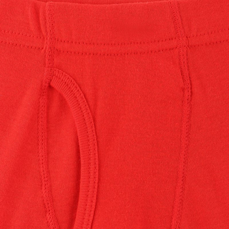 Close-up of red kids innerwear with soft cotton fabric and visible stitching details