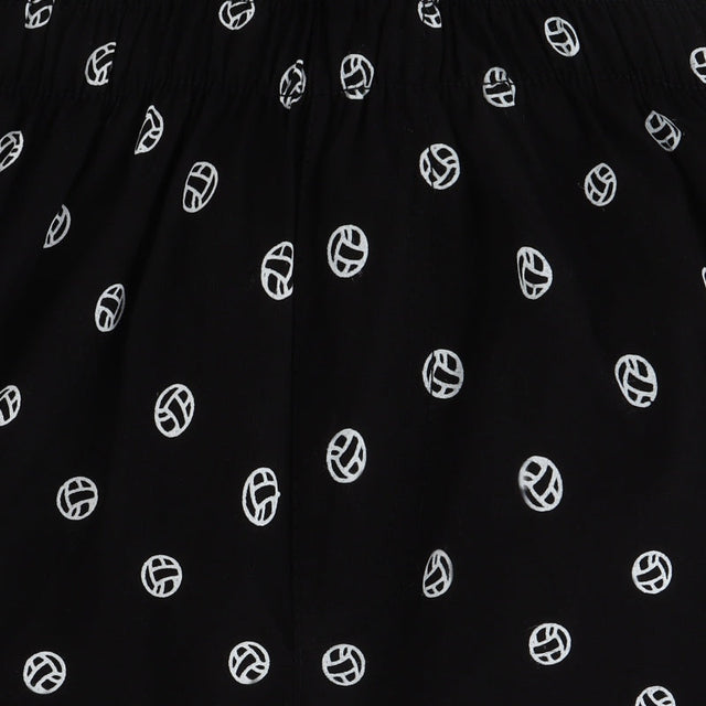 Black kids innerwear fabric with white volleyball print pattern, close-up view