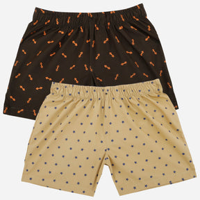 Kids boxer shorts multipack, one black with orange print, one beige with star pattern