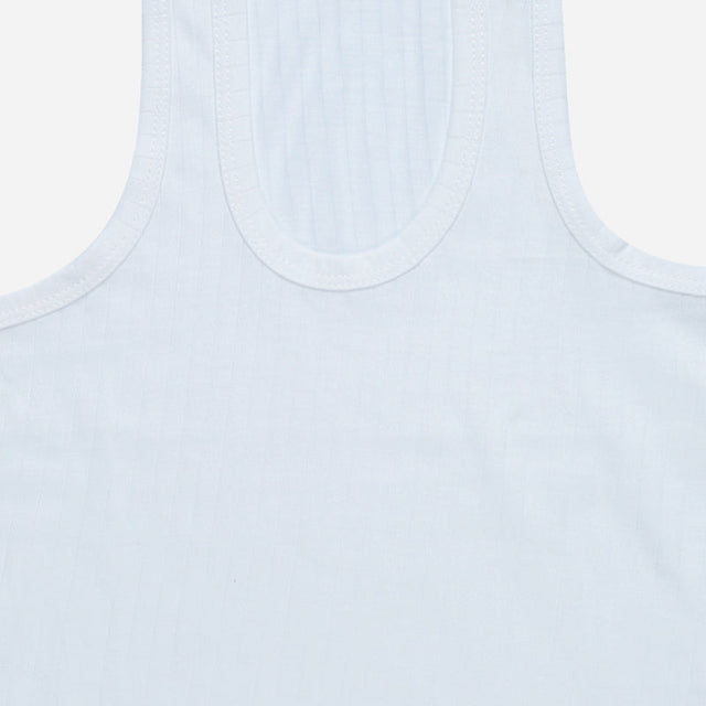 Close-up of kids white sleeveless innerwear vest with soft ribbed fabric texture