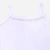 Close-up of white kids camisole with lace detail and thin shoulder straps on plain background