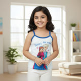Smiling girl in a blue-trim kids camisole with cartoon characters and 'Sisters are magic' text