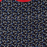 Kids t-shirt fabric with skateboards, wheels, and 'skate' text on black background
